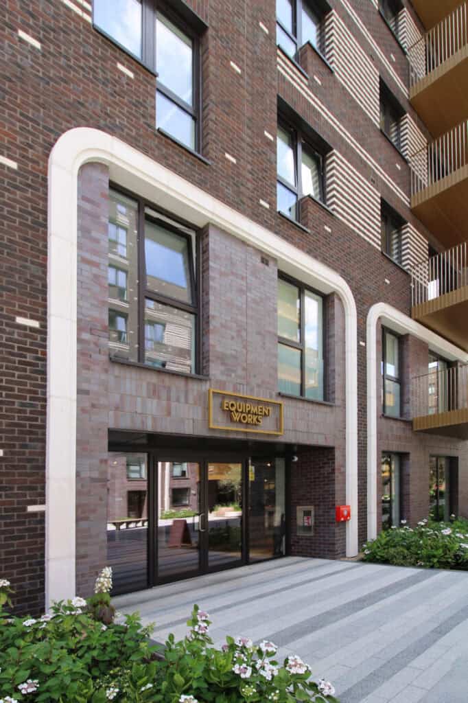 Modern brick apartment building entrance Equipment Works