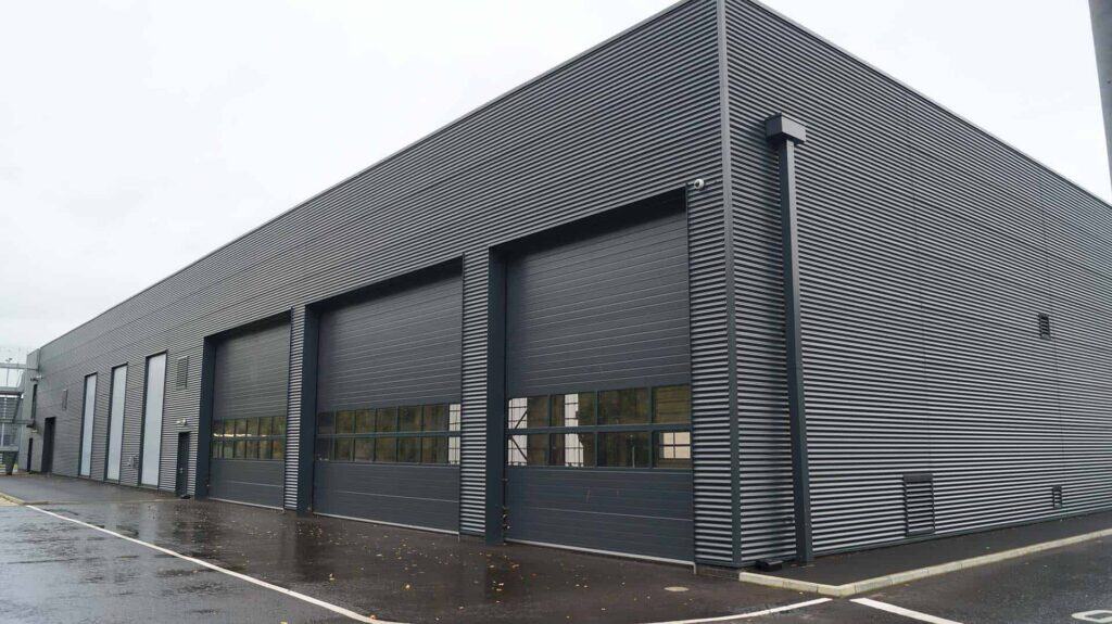 Modern industrial warehouse with large roller shutter doors