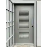 Grey metal louvre security door with ventilation panels