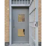 Secure grey prison door with barred gate
